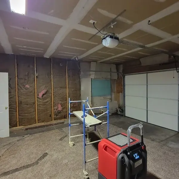 Gutted Circle Pines garage with drying equipment